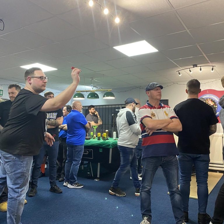 Members playing darts 